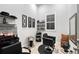 A salon area features a styling chair, shampoo bowl, shelves, and decorative wall art at 22343 Panther Loop, Bradenton, FL 34202