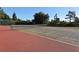 Outdoor tennis court with well-maintained surface and net ready for play at 22343 Panther Loop, Bradenton, FL 34202