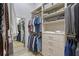 Walk-in closet providing ample storage space with shelves, drawers, and hanging racks at 22343 Panther Loop, Bradenton, FL 34202
