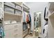 Walk-in closet providing ample storage space with shelves, drawers, and hanging racks at 22343 Panther Loop, Bradenton, FL 34202