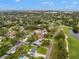 An aerial view of the neighborhood with lush landscapes and close proximity to the golf course and community at 2430 Catalonia S Way, St Petersburg, FL 33712