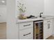 Stylish bar area with wine refrigerator and sleek countertops at 2430 Catalonia S Way, St Petersburg, FL 33712