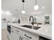 Close-up of a modern island in a remodeled kitchen, showcasing the sink and stylish fixtures at 2430 Catalonia S Way, St Petersburg, FL 33712
