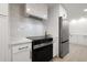 Close-up of kitchen appliances, granite countertops, and modern cabinetry at 2430 Catalonia S Way, St Petersburg, FL 33712