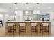 Modern kitchen with island seating, sleek countertops, and stainless steel appliances at 2430 Catalonia S Way, St Petersburg, FL 33712