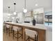 Updated kitchen with an island, bar stools, and access to the outdoor pool area at 2430 Catalonia S Way, St Petersburg, FL 33712