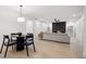 Open-concept living room with fireplace and contemporary furnishings at 2430 Catalonia S Way, St Petersburg, FL 33712