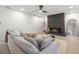 Well-lit living room with modern fireplace, light wood floors and neutral accents at 2430 Catalonia S Way, St Petersburg, FL 33712