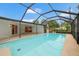 Screened pool with clear blue water, perfect for summer relaxation at 2430 Catalonia S Way, St Petersburg, FL 33712