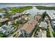 Aerial view of community with several buildings and pool and surrounding waterway at 2729 North Beach Rd # 212, Englewood, FL 34223