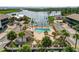 Aerial view of community with pool, landscaping, boat dock, and waterfront views at 2729 North Beach Rd # 212, Englewood, FL 34223