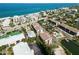 Stunning aerial view of community featuring condo buildings, lush greenery, private beach access, and waterways at 2729 North Beach Rd # 212, Englewood, FL 34223