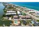 An aerial view showcases how close the building is to the bay and beach at 2729 North Beach Rd # 212, Englewood, FL 34223