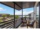 Relax on this condo's balcony with seating and enjoy the view of the community and waterfront at 2729 North Beach Rd # 212, Englewood, FL 34223