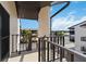Balcony view overlooking the building's common area, pool, and waterway adding charm to this condominium complex at 2729 North Beach Rd # 212, Englewood, FL 34223