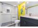 Bright bathroom features a walk-in shower with stylish tile accents, plus modern vanity and fixtures at 2729 North Beach Rd # 212, Englewood, FL 34223