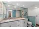 Clean bathroom featuring double sinks, updated fixtures and large mirror at 2729 North Beach Rd # 212, Englewood, FL 34223