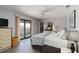 Comfortable primary bedroom with a balcony and natural light at 2729 North Beach Rd # 212, Englewood, FL 34223