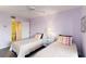 Cozy bedroom featuring twin beds and an ensuite bathroom at 2729 North Beach Rd # 212, Englewood, FL 34223