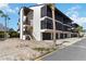 Attractive two-story condominium building offering private screened-in patios, convenient parking garages, and ample outdoor staircase access at 2729 North Beach Rd # 212, Englewood, FL 34223