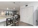 An open kitchen overlooking the living room features bar seating and provides ample storage space throughout at 2729 North Beach Rd # 212, Englewood, FL 34223