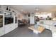 An open-concept living space with a combined living room, dining area, and kitchen with modern finishes at 2729 North Beach Rd # 212, Englewood, FL 34223