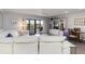 Bright living room with sliding doors to balcony, white sofa and built-in entertainment center at 2729 North Beach Rd # 212, Englewood, FL 34223