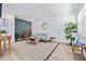 Cozy living room with modern decor, wood paneling, stylish furniture, and ample natural light at 3016 Gulf Dr, Holmes Beach, FL 34217