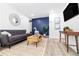 Stylish living room featuring contemporary decor, a comfortable sofa, and modern accents at 3016 Gulf Dr, Holmes Beach, FL 34217