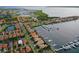 Aerial view of waterfront homes, boat docks and lush landscaping in a vibrant residential community at 303 9Th E Ave, Palmetto, FL 34221
