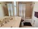 Bathroom with integrated shower and tub features a large mirror, natural light, and modern hardware at 303 9Th E Ave, Palmetto, FL 34221