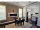 Dining room features an accent wall with a linear fireplace and is adjacent to the open concept kitchen at 303 9Th E Ave, Palmetto, FL 34221