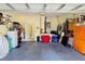 Spacious two car garage with ample storage space, a clean floor, and easy access to the home at 303 9Th E Ave, Palmetto, FL 34221