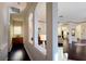 Hallway with archways and hardwood floors, offering seamless transition between living spaces at 303 9Th E Ave, Palmetto, FL 34221