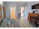 Living room with comfortable seating features a ceiling fan, access to bathroom and pool at 303 9Th E Ave, Palmetto, FL 34221