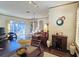 Bright, open concept living area with hardwood floors, modern lighting, and a view of the outdoor space at 303 9Th E Ave, Palmetto, FL 34221