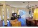 Hardwood floors and an open layout enhance the spacious living area, providing access to the outdoor space at 303 9Th E Ave, Palmetto, FL 34221