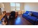 Spacious office featuring hardwood floors, a comfortable sofa, and a built-in desk at 303 9Th E Ave, Palmetto, FL 34221