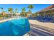 Community pool offers a refreshing escape, with lounge chairs and tables for ultimate relaxation at 303 9Th E Ave, Palmetto, FL 34221