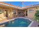 Private pool with a spa, brick paving, and a covered lanai at 303 9Th E Ave, Palmetto, FL 34221