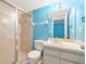 Bathroom featuring a shower stall, toilet, and vanity sink for convenience at 3072 Lake Bayshore Dr # 119, Bradenton, FL 34205