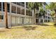 Building exterior with multiple windows and a lawn, enhancing its appeal and curb presence at 3072 Lake Bayshore Dr # 119, Bradenton, FL 34205