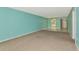 Spacious living room flowing into the kitchen with neutral carpet at 3072 Lake Bayshore Dr # 119, Bradenton, FL 34205