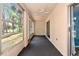 Enclosed sunroom with big windows, ceiling fan, perfect for relaxing and enjoying the natural light at 3072 Lake Bayshore Dr # 119, Bradenton, FL 34205
