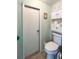Bathroom featuring toilet and storage for towels and toiletries in this compact space at 3402 Shingle Oak Ter, Sarasota, FL 34237