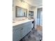 Bathroom vanity with gray cabinets, modern sink, and ample counter space and natural lighting at 3402 Shingle Oak Ter, Sarasota, FL 34237