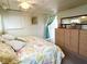 Bedroom with coordinated decor, featuring a floral patterned bedspread and soft furnishings, creating a relaxing retreat at 3402 Shingle Oak Ter, Sarasota, FL 34237