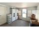 Bright sunroom with ample natural light, storage cabinets, and easy access to the outdoors at 3402 Shingle Oak Ter, Sarasota, FL 34237