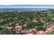 A bird's-eye view of the neighborhood, showcasing the lush landscaping and proximity to the bay at 3500 El Conquistador Pkwy # 128, Bradenton, FL 34210