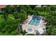 Aerial view of the community pool and surrounding green spaces at 3500 El Conquistador Pkwy # 128, Bradenton, FL 34210